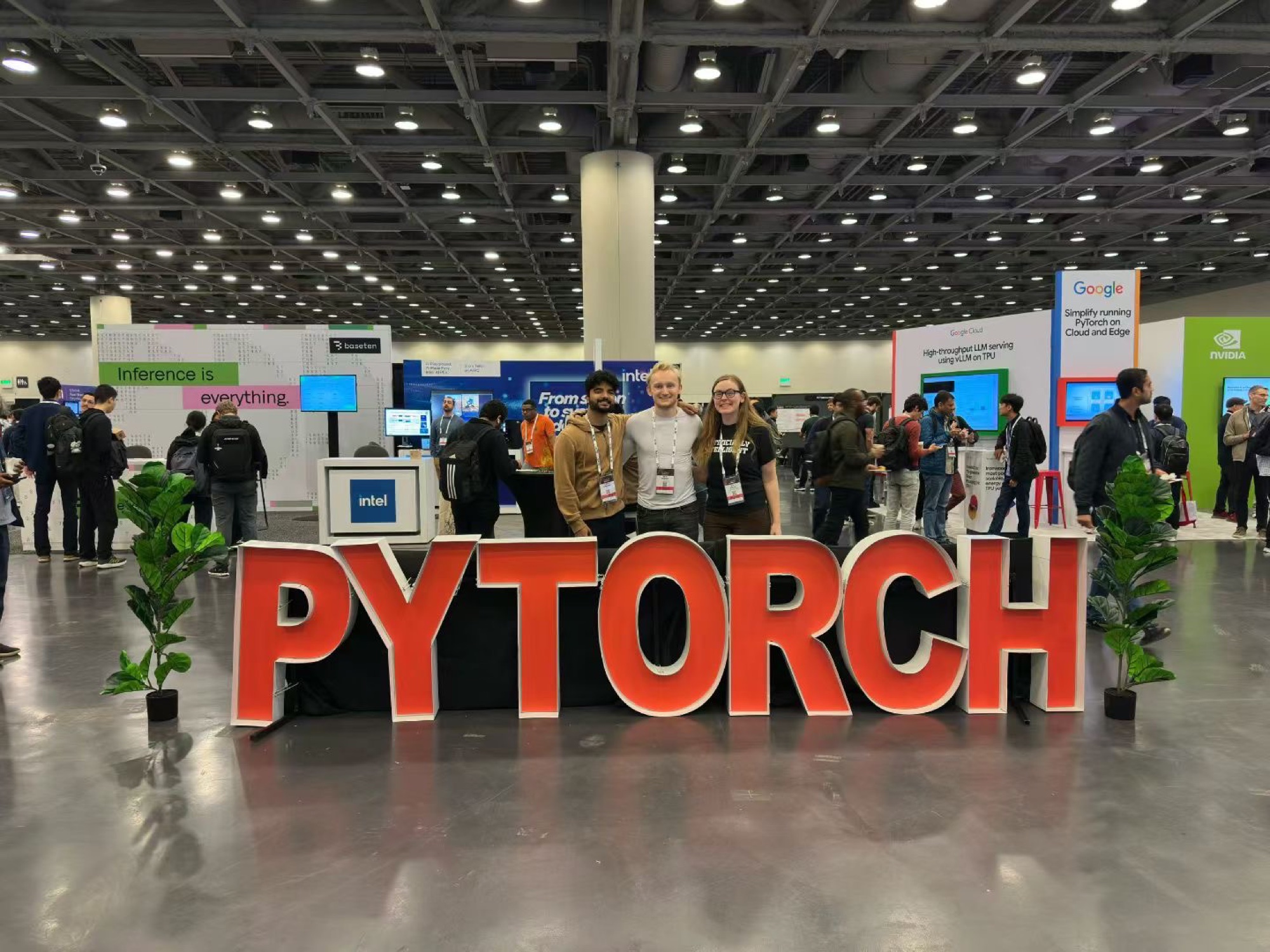 Three founders behind the giant PYTORCH letters at the PyTorch Conference